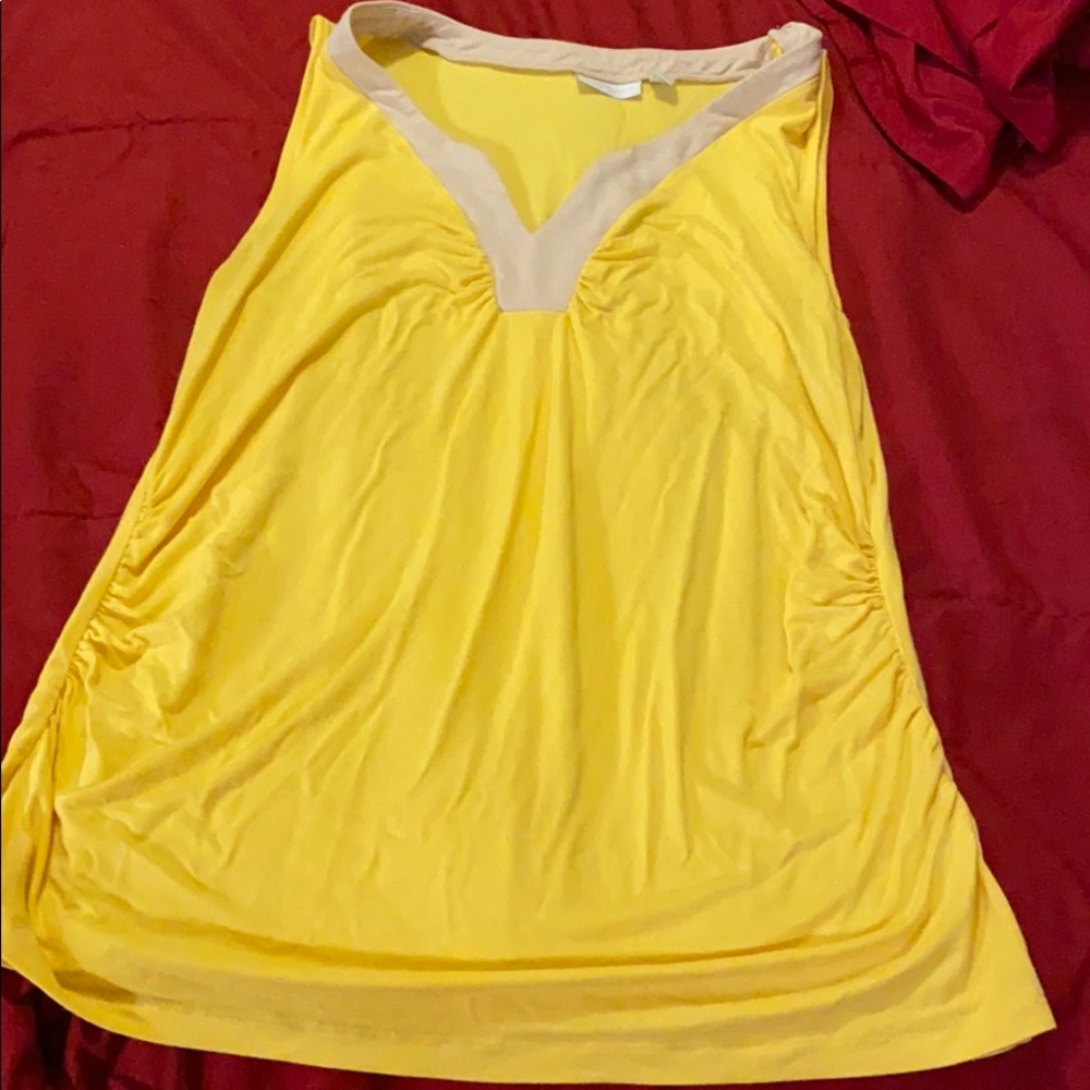 Bright yellow sleeveless spandex casual top.